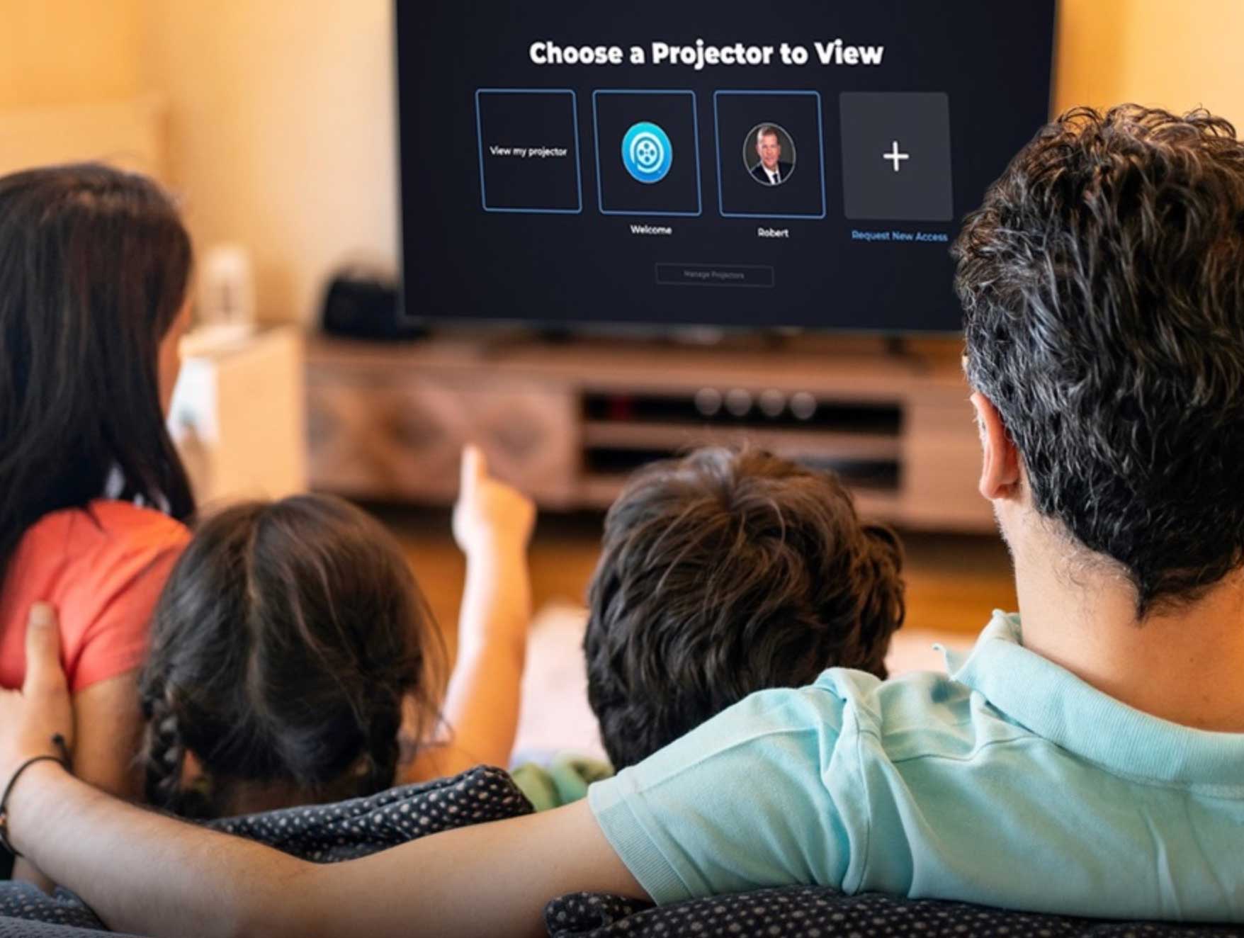 family watching home movies on projector streaming app